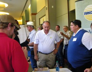 Suncoast's Larry Stadler and Matt Barlow, right, visit with builders