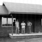 Bud Blakley, right, has been building a long time. Here, he welcomes a new family to their home he's completed, this from the 1970s.
