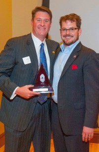 Phil Rhees, left, accepts the honor of Oklahoma �Builder of the Year' on behalf of his father, Bill. With Rhees is last year's �Builder of the Year,' Tulsan Brandon Perkins.